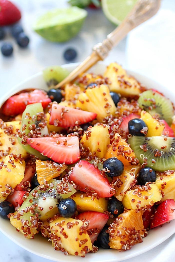Quinoa Fruit Salad tossed in a Sweet Lime Dressing - a colorful, healthy side dish that goes with any meal! AD
