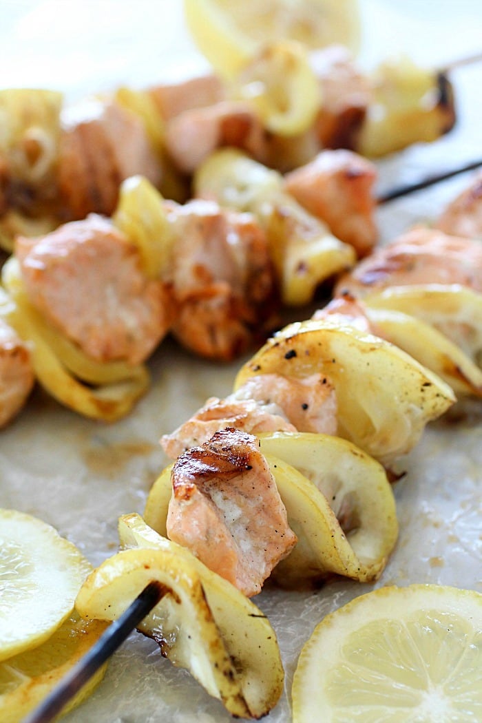 Salmon Skewers tossed in a garlic-lemon sauce and then grilled. So simple and so flavorful! Salmon and citrus is combined to create the result of a crazy delicious, tender, lemony salmon that is like heaven on a stick!