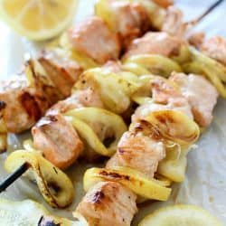 Salmon Skewers tossed in a garlic-lemon sauce and then grilled. So simple and so flavorful! Salmon and citrus is combined to create the result of a crazy delicious, tender, lemony salmon that is like heaven on a stick!