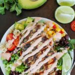 Ditch the tortilla and put everything you love about burritos into a yummy chicken burrito bowl! This recipe is so easy and adaptable to what you like. The best part of this recipe is the tender, marinated and grilled chicken! Add in any combo of brown rice, black beans, lettuce, corn, avocado, cheese, green onions, cilantro, tomatoes, salsa and a drizzling of ranch taco sauce. A fresh, delicious and healthy lunch or dinner!