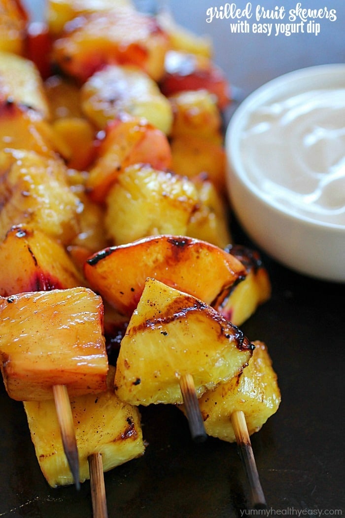 Fruit Skewers are grilled with a sweet cinnamon glaze and dipped in a delicious easy yogurt dip! You will go crazy for these grilled fruit skewers! AD