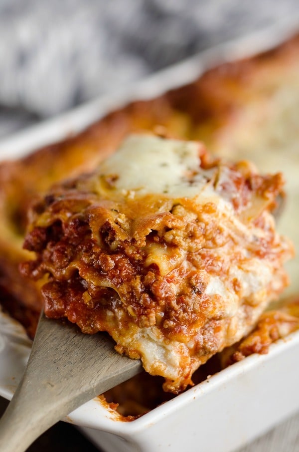 This Lasagna Recipe is a hearty casserole that is a classic dinner everyone will love! Ground beef and pork are layered with cheese and pasta for a comforting dinner idea perfect for a family gathering or holiday.