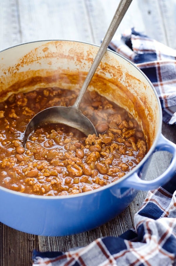 Light Turkey V8 Chili is an easy and healthy 20 minute weeknight dinner idea with only 6 ingredients and a whole lot of flavor. This dish is loaded with nutrition from V8 juice, lean ground turkey and beans for a hearty meal the whole family will love. An added bonus – the leftovers are freezer friendly!