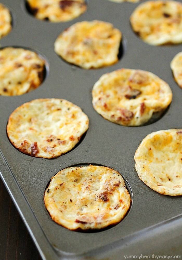 Mini Bacon Egg Muffins are healthy little breakfast bites full of yummy protein. Only 43 calories and 3 grams of protein in every mini egg muffin! They're easy to make and perfect to make ahead and grab on the go! AD