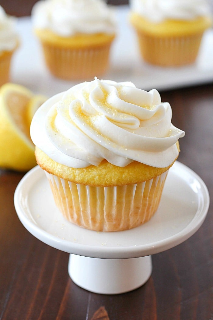 Lemon Cupcakes made with only 2 Ingredients and then frosted with a quick and easy lemon frosting! You won't believe how soft and delicious these cupcakes are! Plus a round-up of more delicious cupcake recipes you won't want to miss!