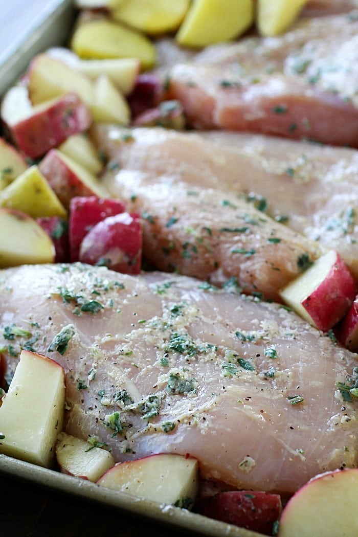 One-Pan Herb Baked Chicken and Potatoes makes making dinner a breeze! Chicken and potatoes are coated in a delicious salty herb rub and baked in one pan. The baked chicken is tender and juicy and the potatoes have so much flavor. This is an easy dinner everyone will love! AD