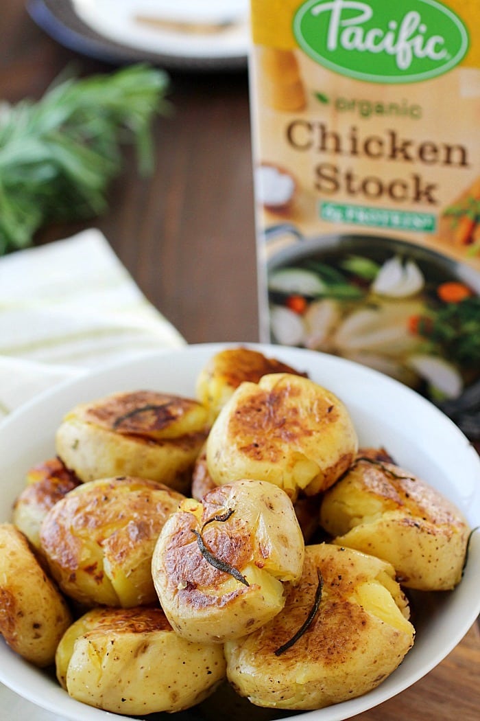 Smashed Potatoes (also known as Potatoes Fondantes) are seriously the best potatoes you will ever eat!! They're boiled in chicken stock and rosemary until tender and then smashed down and browned on each side. Crispy on the outside, tender and flavorful on the inside! Definitely a must-make side dish! AD