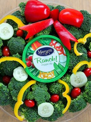 Turn your boring veggie tray into something cute for the holidays with this Christmas Wreath Holiday Veggie Tray! It's simple to make but will leave a lasting impression on your guests at any holiday party! AD