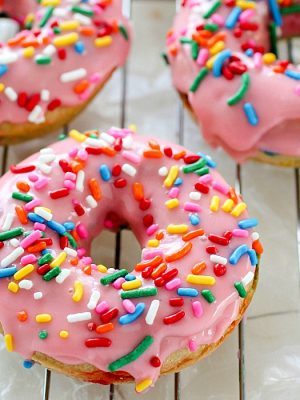 Baked Funfetti Donuts aka Birthday Donuts! These homemade donuts are made with healthier ingredients and baked. Topped with an easy glaze and funfetti sprinkles! Every bite has funfetti sprinkles!