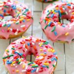 Baked Funfetti Donuts aka Birthday Donuts! These homemade donuts are made with healthier ingredients and baked. Topped with an easy glaze and funfetti sprinkles! Every bite has funfetti sprinkles!
