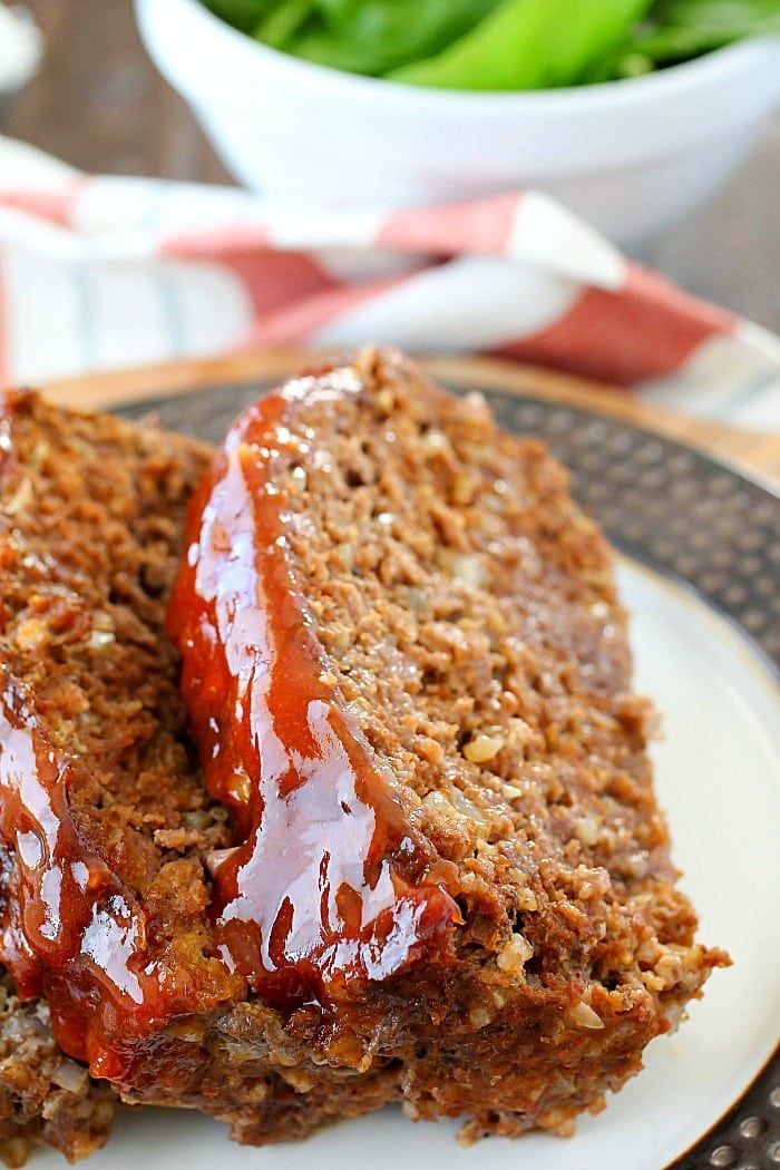 This Meatloaf Recipe is my family's FAVORITE Sunday night dinner! It really is the Best Ever Meatloaf, and it is incredibly easy to make. So much flavor packed inside with a delicious glaze spread on the top!