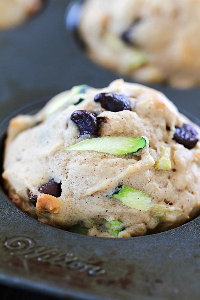 These Chocolate Chip Zucchini Muffins are the best of both worlds - healthy AND decadent! They're full of tender zucchini and chocolate chips but are made healthier by using applesauce instead of lots of butter. These make a yummy breakfast or after school snack!