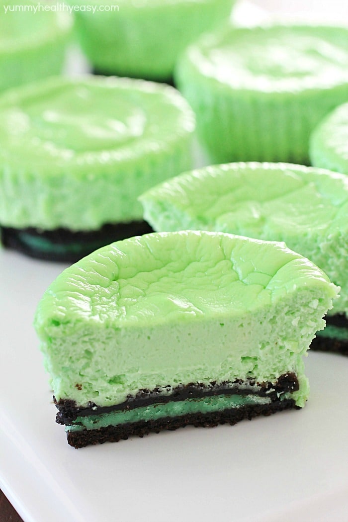 Skinny Mini Mint Cheesecakes with an Oreo crust! This lighter mint cheesecake recipe is super easy to make and you only need a few ingredients to whip up a batch. These cute cheesecakes have less calories than a regular cheesecake plus built-in portion control with the muffin size!