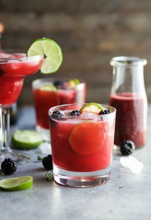 Thyme Blackberry Margaritas, as gorgeous as they are delicious! This is one smooth margarita with a hint of citrus, blackberry flavor and subtle notes of fresh thyme! You’re gonna fall in love!
