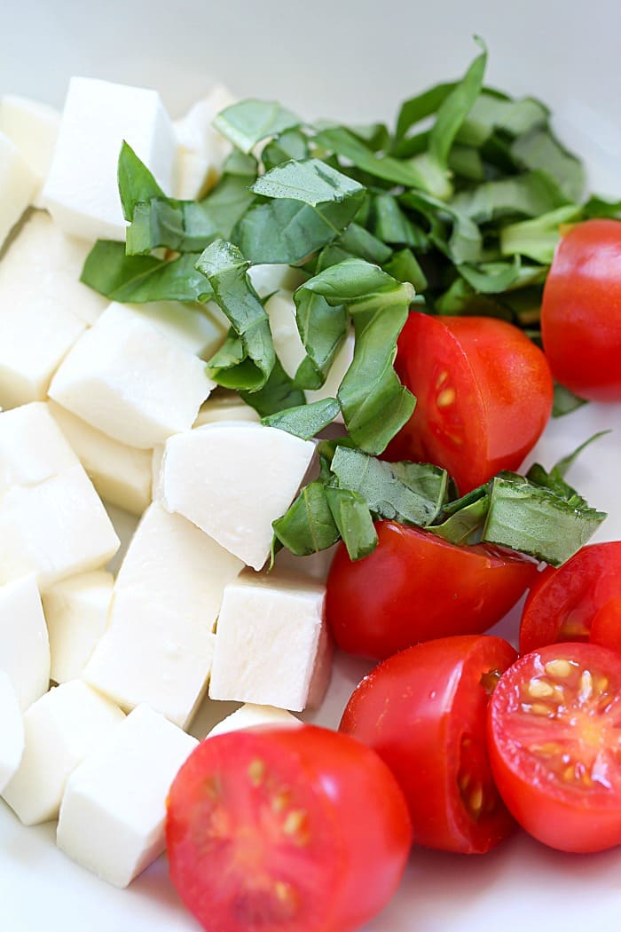 This Easy Tortellini Pesto Salad is full of tortellini pasta, cherry tomatoes, mozzarella, basil and pesto - you can't go wrong!