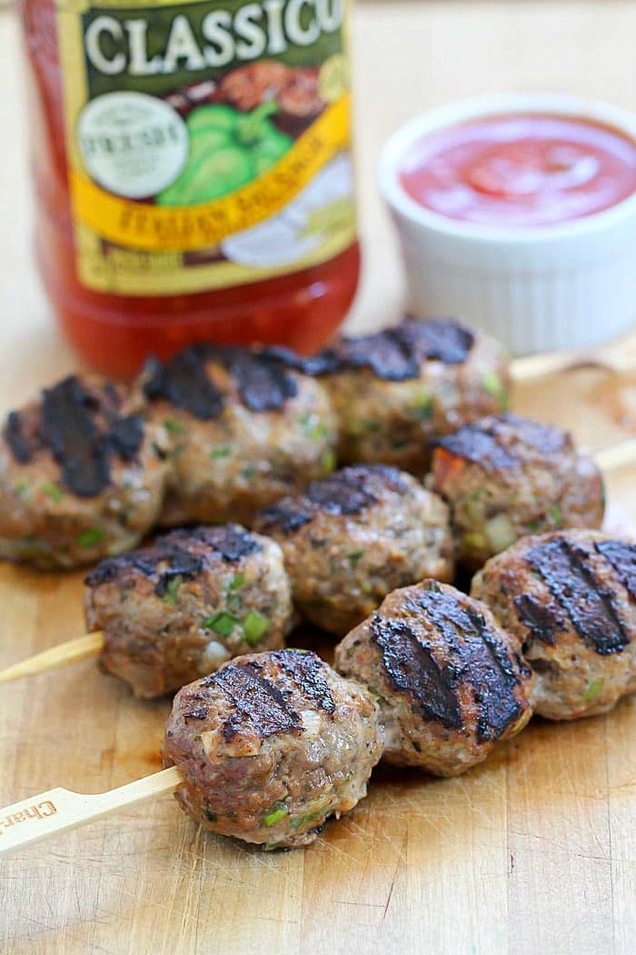 These flavorful Italian Meatballs are skewered onto sticks and grilled. This versatile dinner can be dipped in pasta sauce for a delicious low carb dinner, served on rolls for meatball sandwiches or over spaghetti! AD