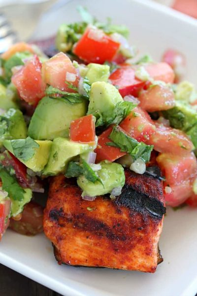 This Spicy Grilled Salmon has an easy to make, sweet/spicy rub that everyone will love! Topped with Avocado Salsa, this dinner is sure to please!