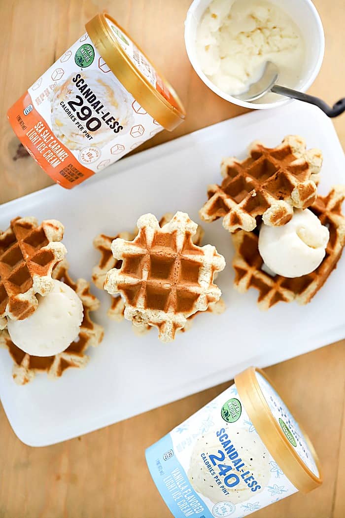 Overhead view of three waffle sandwiches with Scandal-Less ice creams next to them.