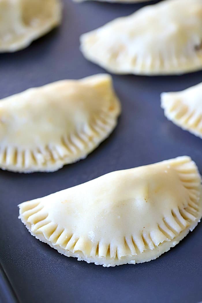 A tray of uncooked empanadas...