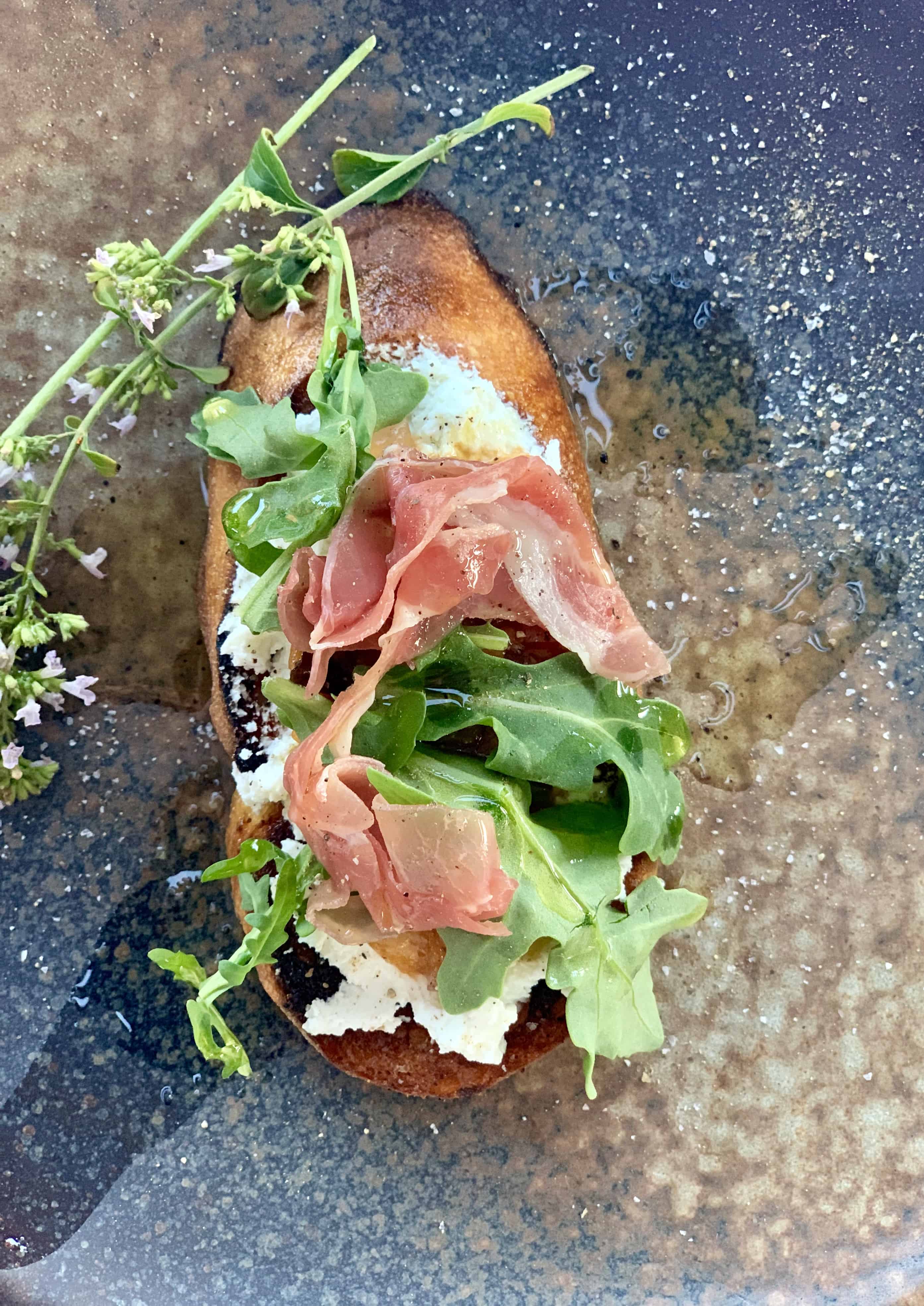 Prune Bruschetta on a pretty plate