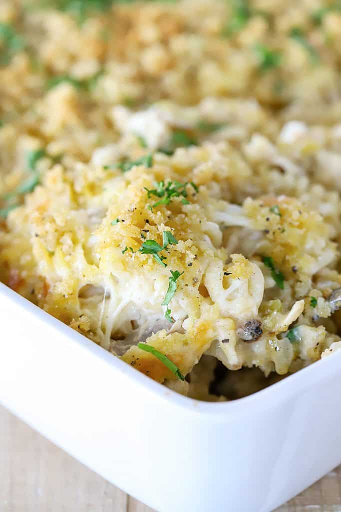 Cheese pull shot from the casserole dish! You can see all of the yummy insides of the creamy casserole.