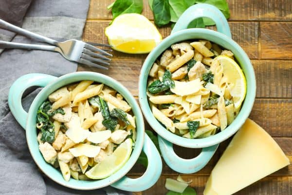 sideways view of two blue bowls filled with Lemon Chicken Pasta